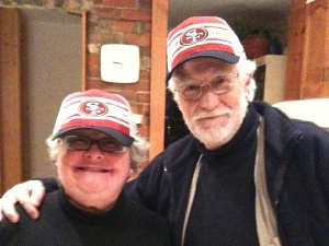 Tony and Heather wearing 49ers hats