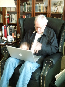 Tony, rapidly typing on his laptop