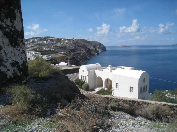 A house perched on the lip of the Santorini Caldera